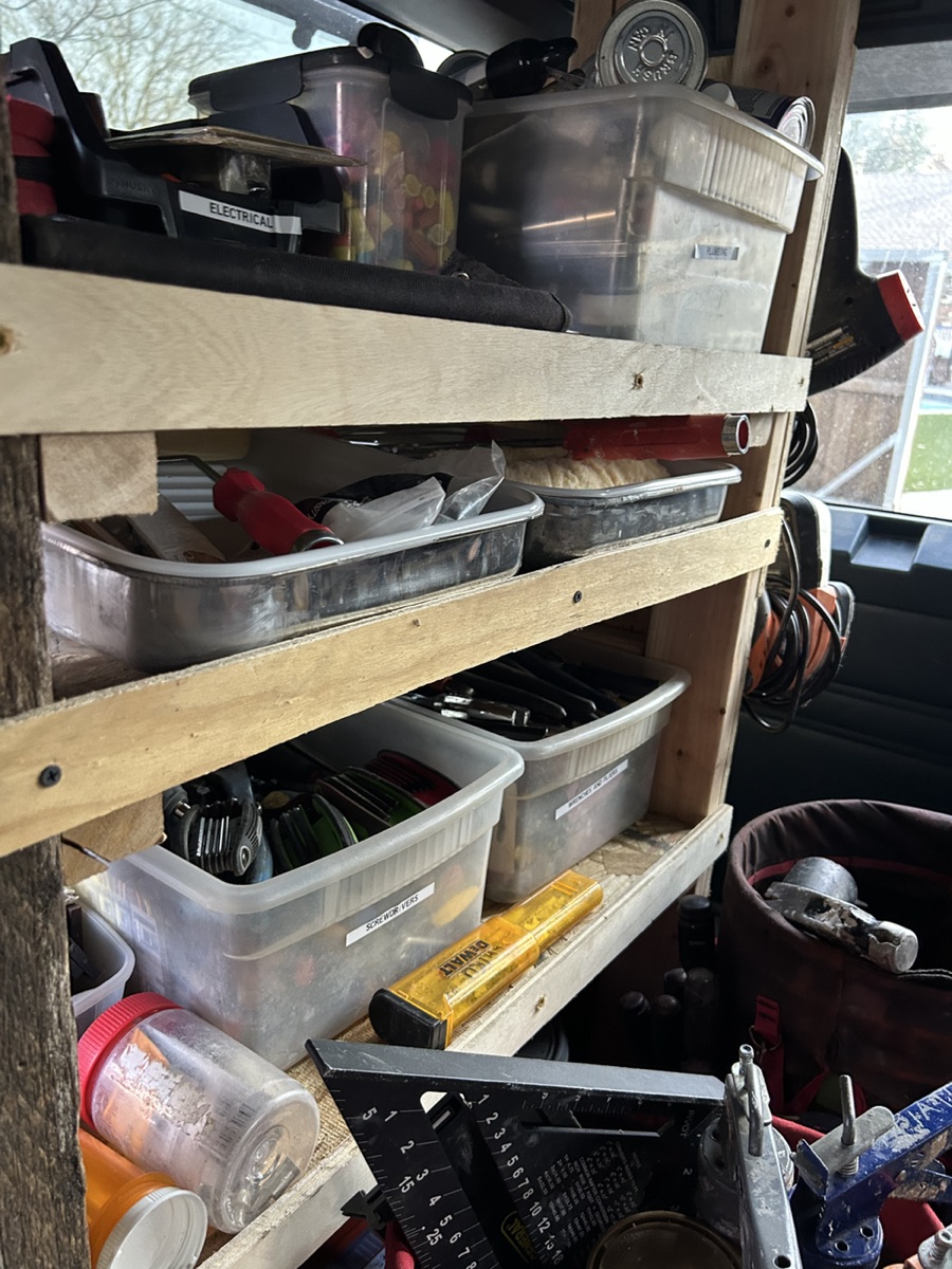Interior shelving and organized tools inside the Piatt work van