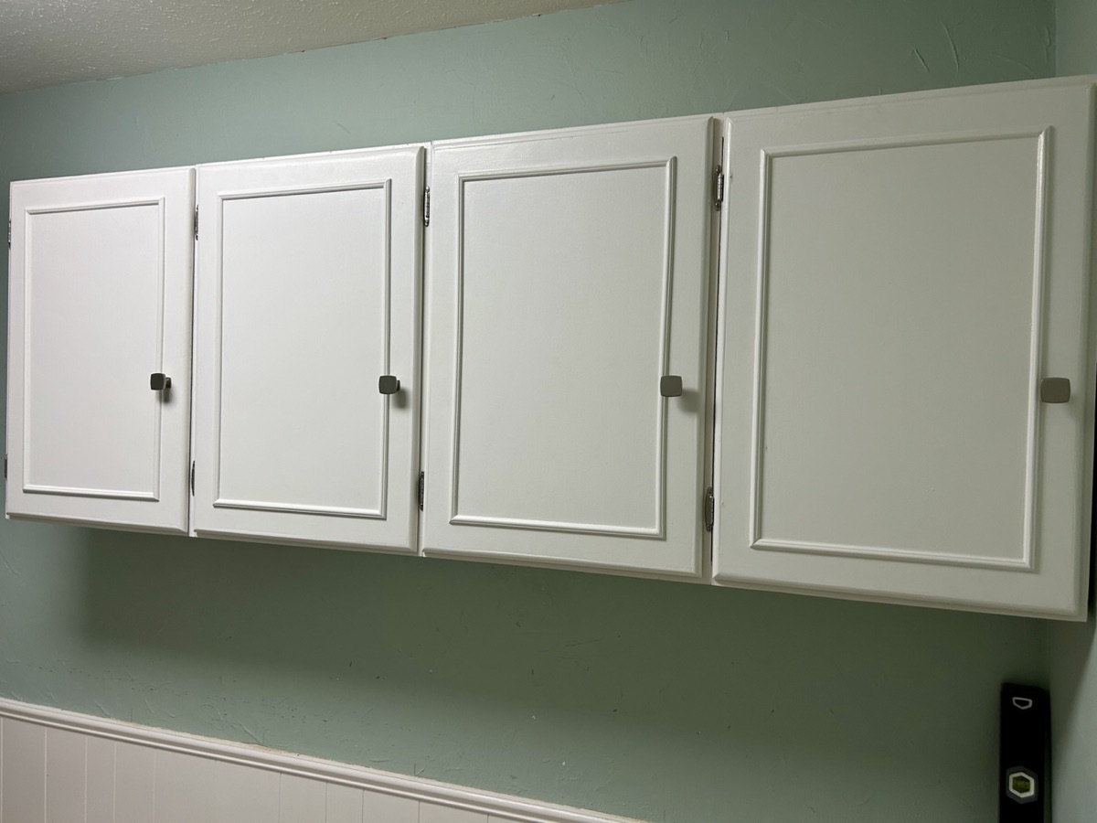 Finished utility room cabinets and shelf
